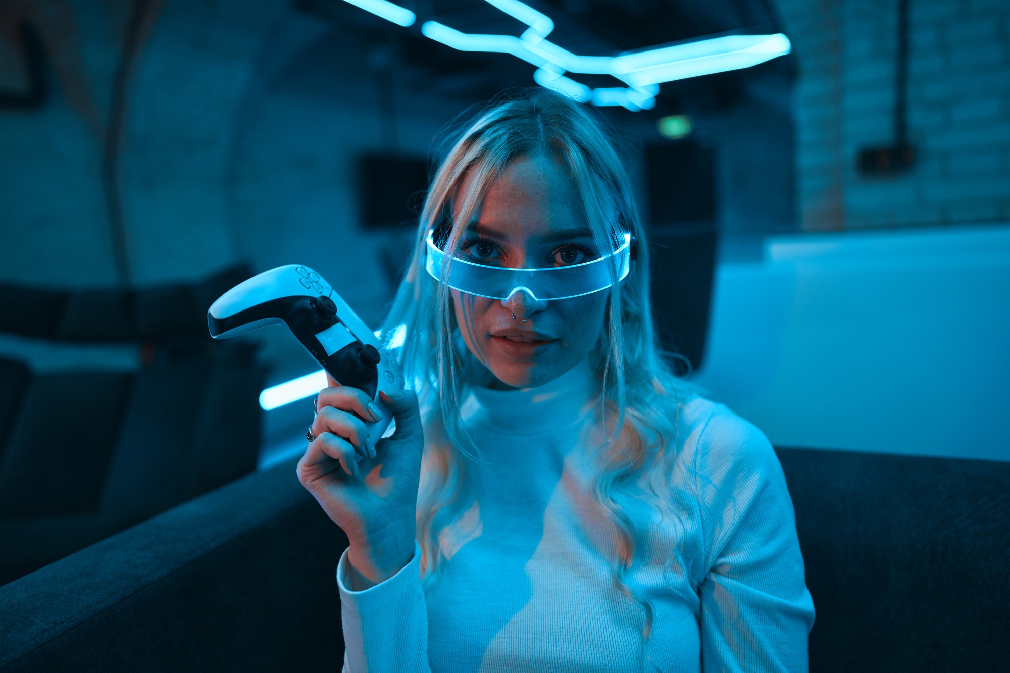 Young female gamer playing video games.